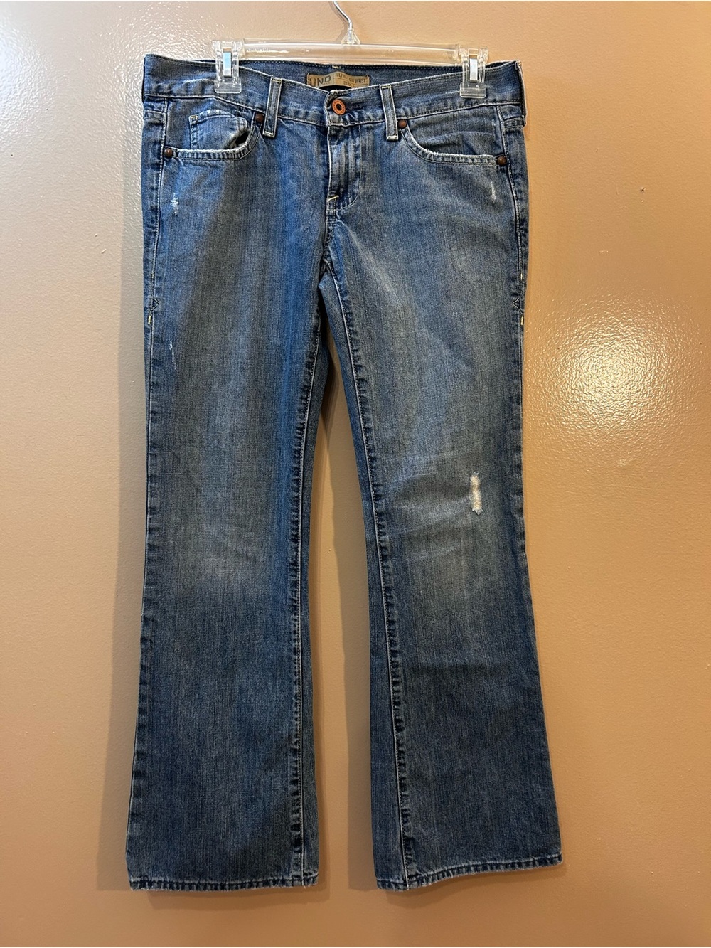 Women’s Blue Flare Jeans with Subtle Distress